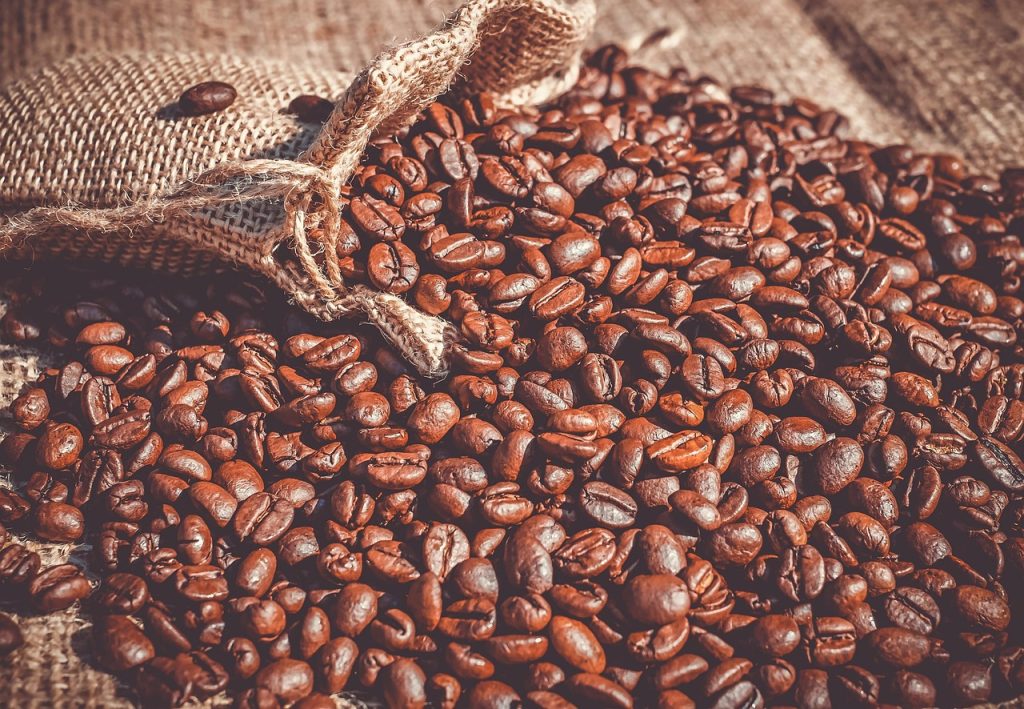 dried coffee grounds in small cotton sachet bag