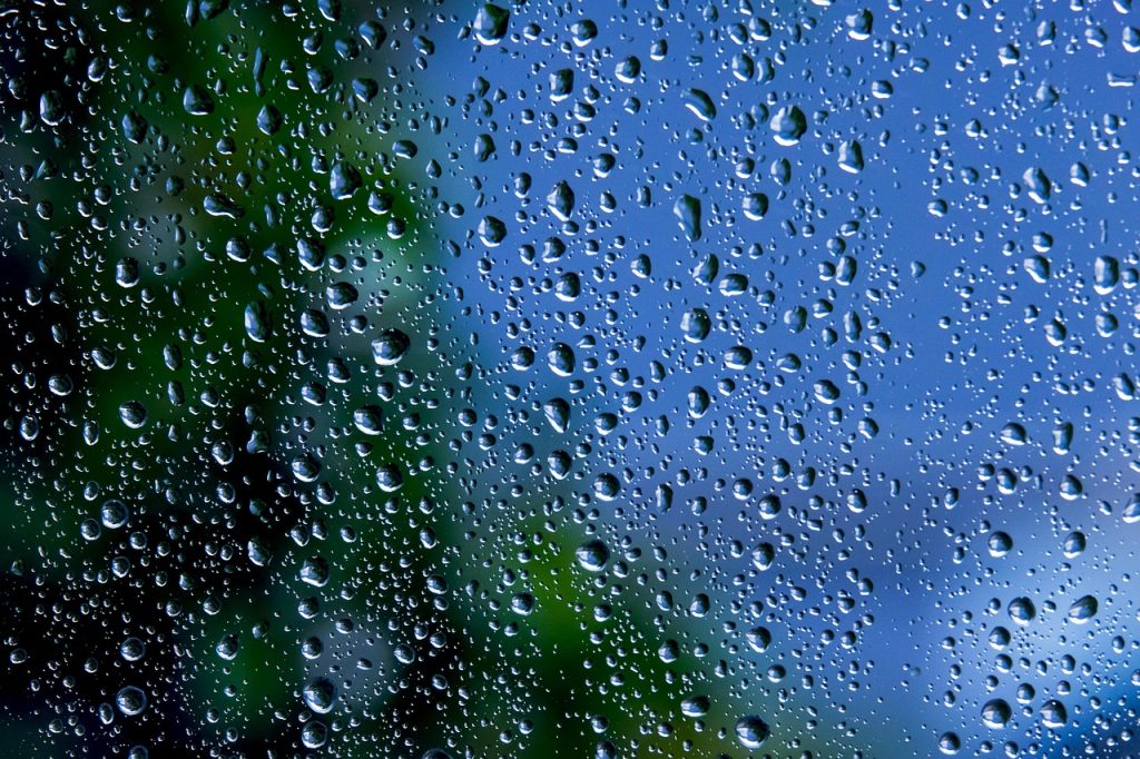microfiber cloth cleaning window close-up