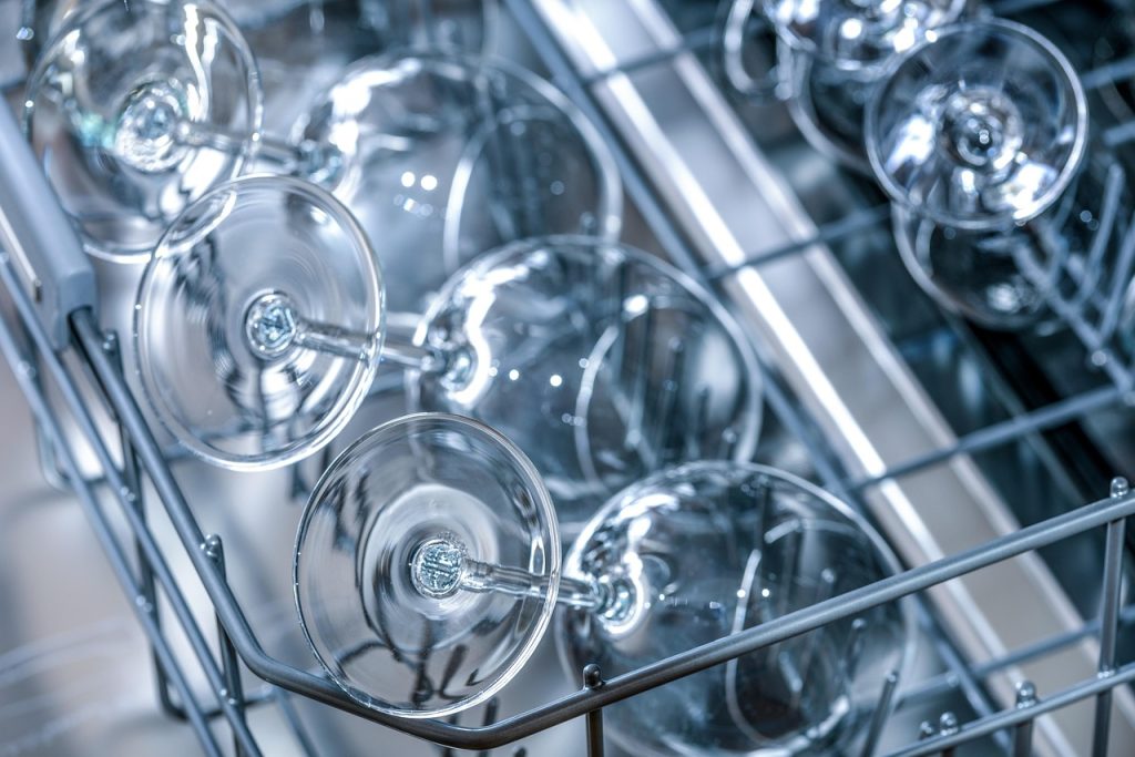 sparkling clean bowl held up to light after hand washing without dishwasher