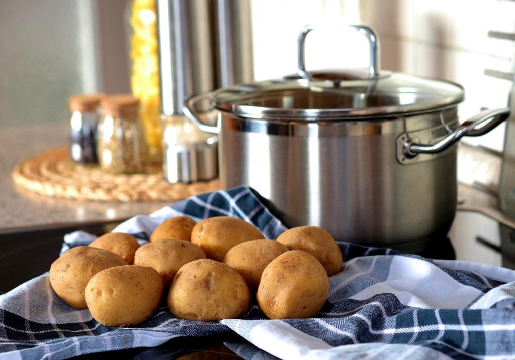 potatoes and onions stored in cool dark pantry versus summer kitchen counter comparison