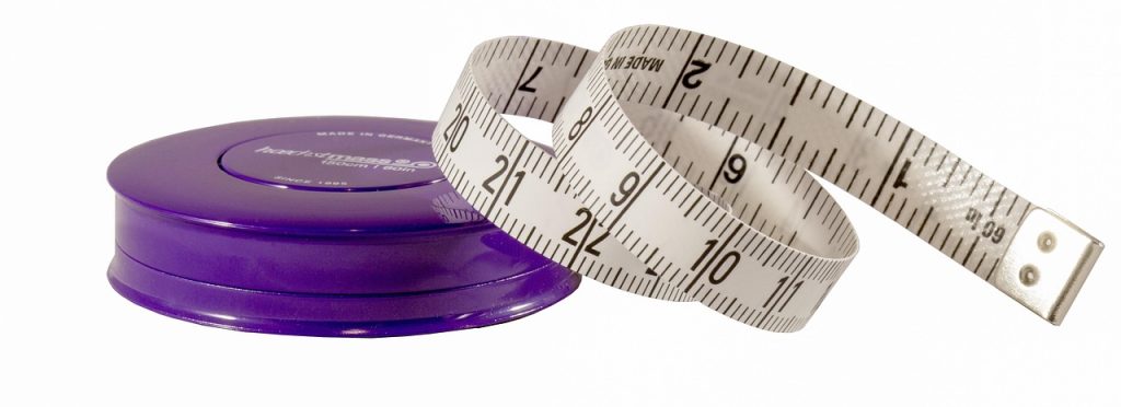 measuring kitchen drawer tray size with a tape measure