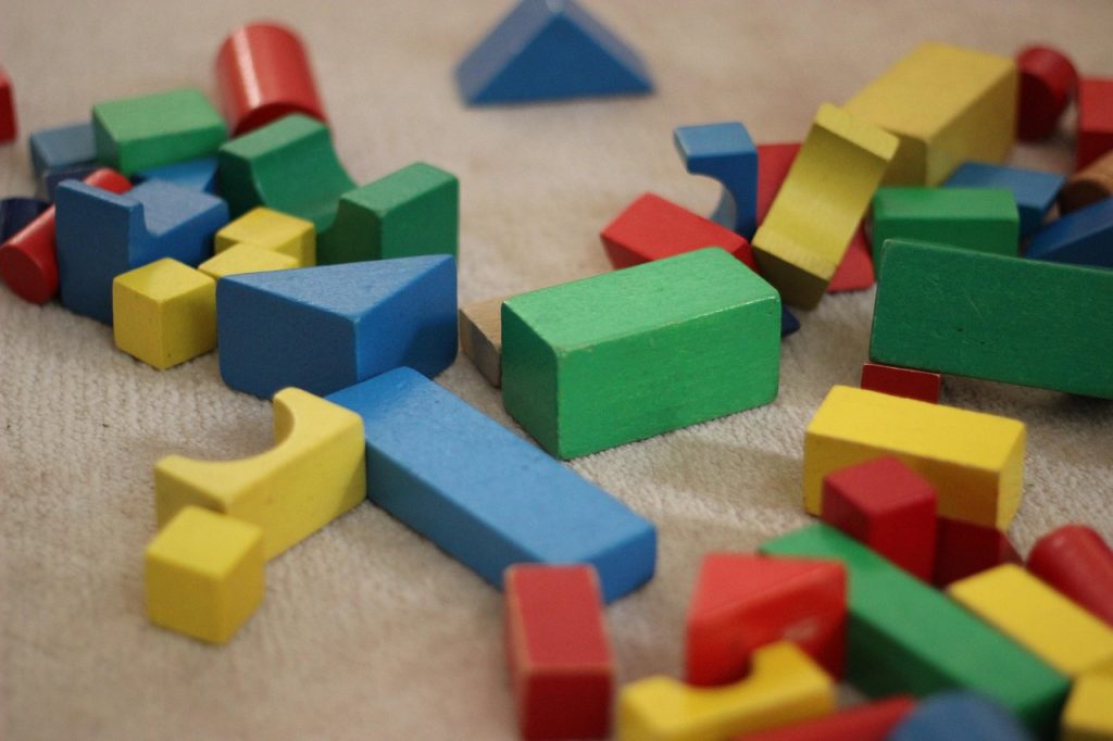 before and after comparison of kids room toy clutter