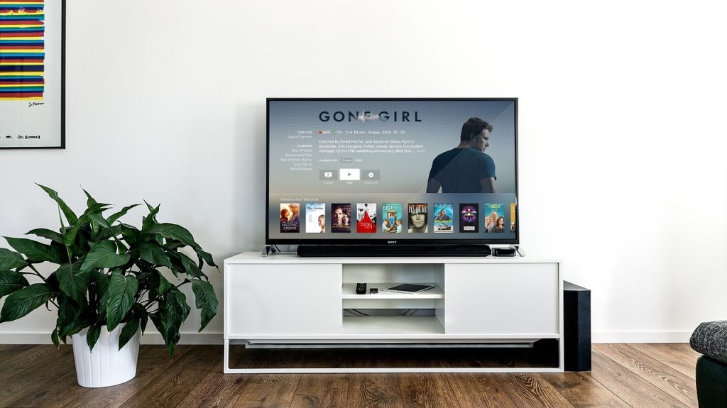 clean organized living room TV stand after tips