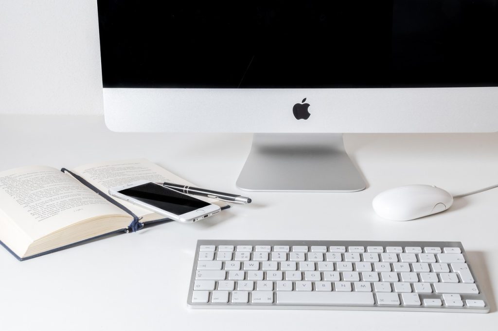 smartphone charger neatly clipped to desk edge for easy access
