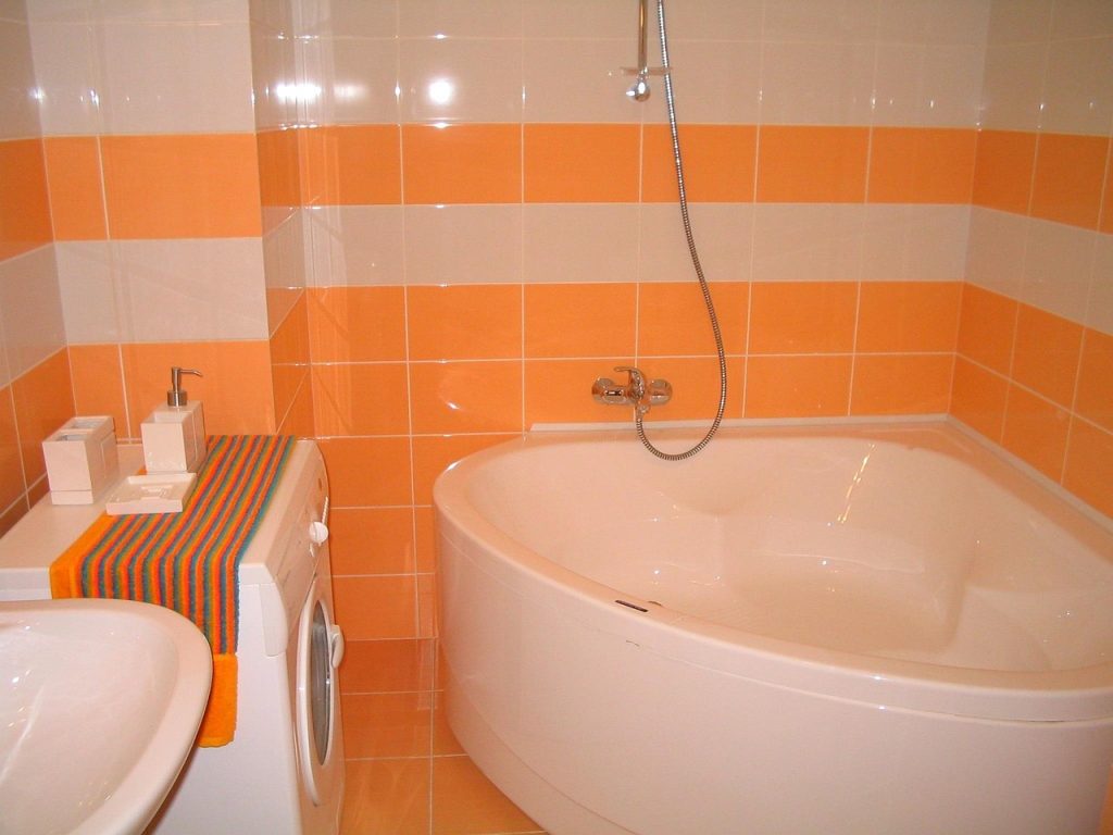 shower corner caddy with suction cups mounted on white tiles