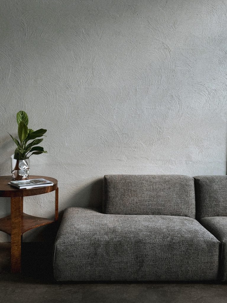living room side table with a small tray holding only essential items