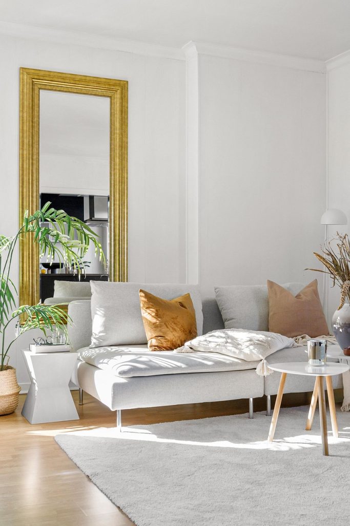 round wooden tray on a side table with minimal organized items