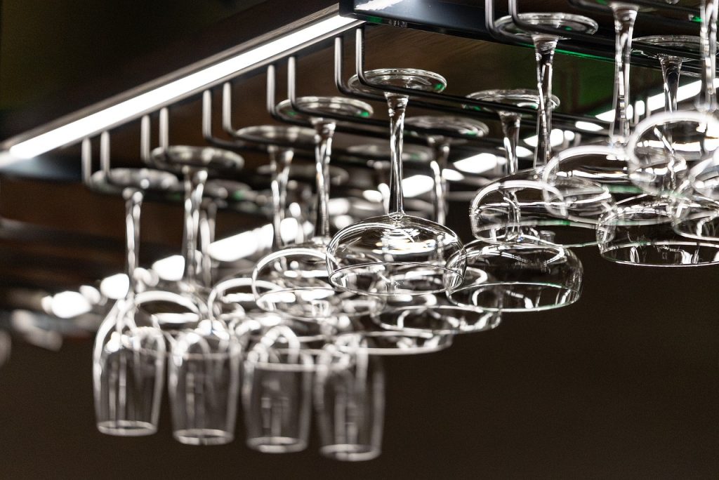 balcony cleaning tools hanging on wall hooks organized