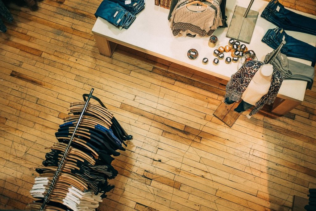 sorting shopping bags by category on floor