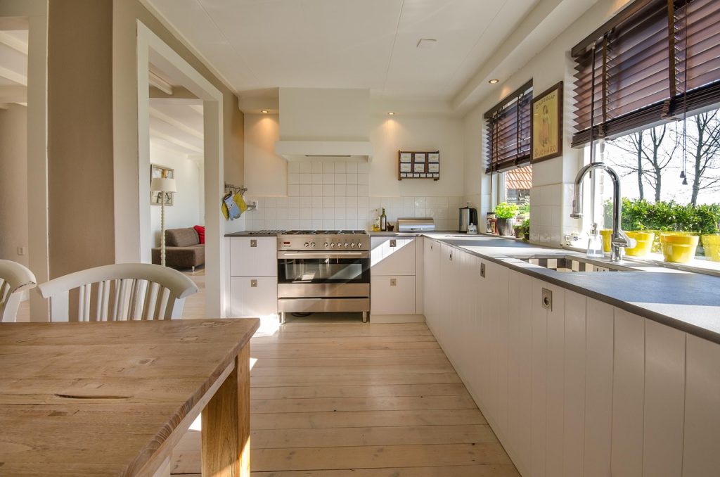 bowls stored vertically inside file box in kitchen cabinet