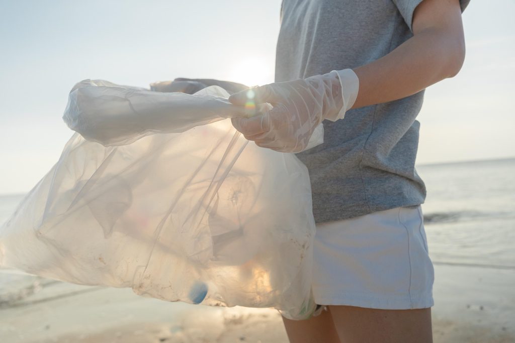 person decluttering and donating excess plastic bags