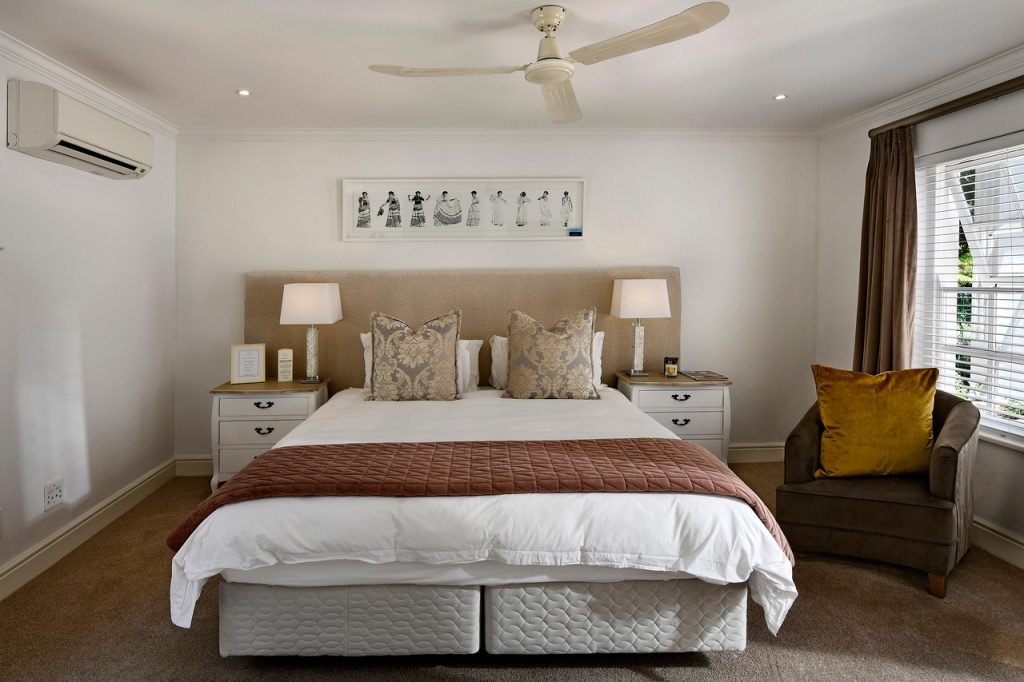 organized moving boxes labeled by room placed in correct rooms
