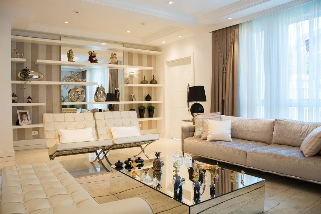tidy living room with minimal toys visible on shelf