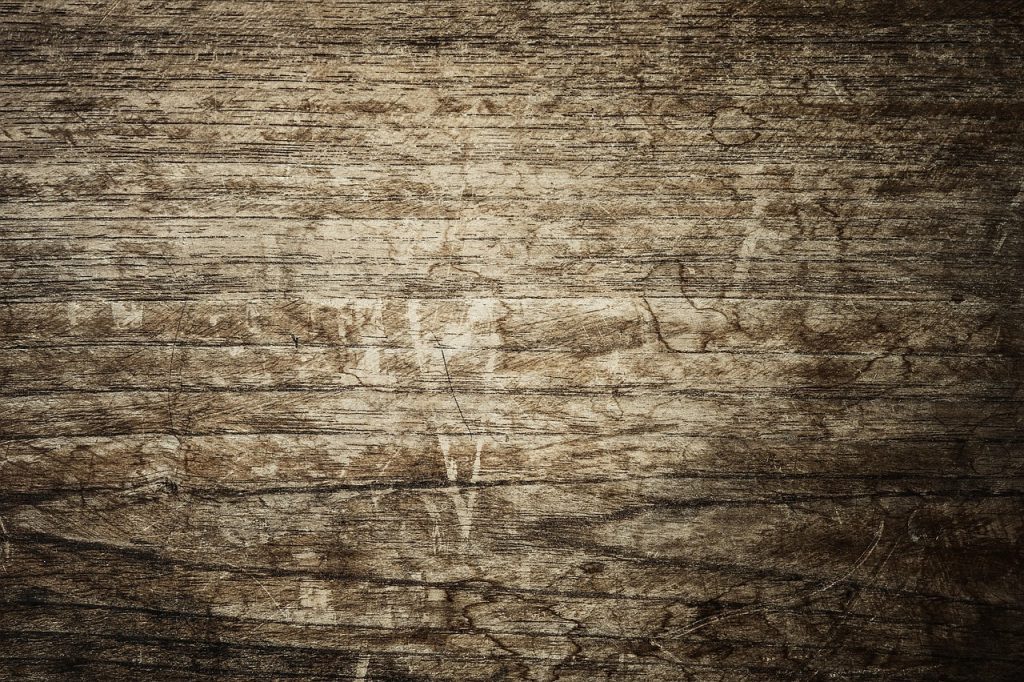 lemon and coarse salt on wooden cutting board for natural sanitizing